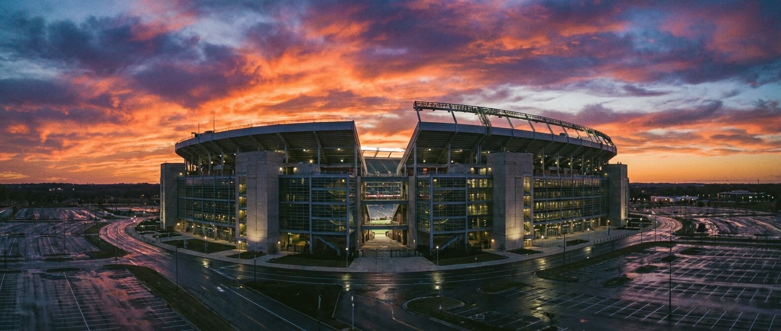charter-bus-to-army-navy-game-stadium-exterior-at-dusk