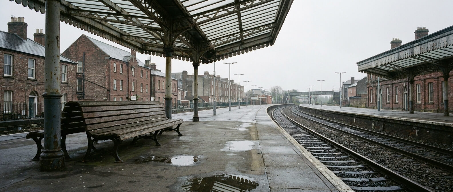 charter-bus-vs-train-for-a-group-trip-empty-platform-bench